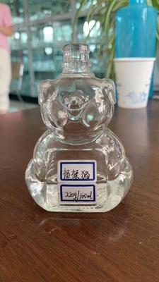 Bouteille de whisky en forme de bonhomme de neige transparente en verre de flint avec une surface décalée