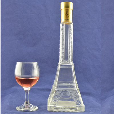 Matériau de verre en flint en relief haute Tour Eiffel Bouteille en verre en forme de liqueur avec liège