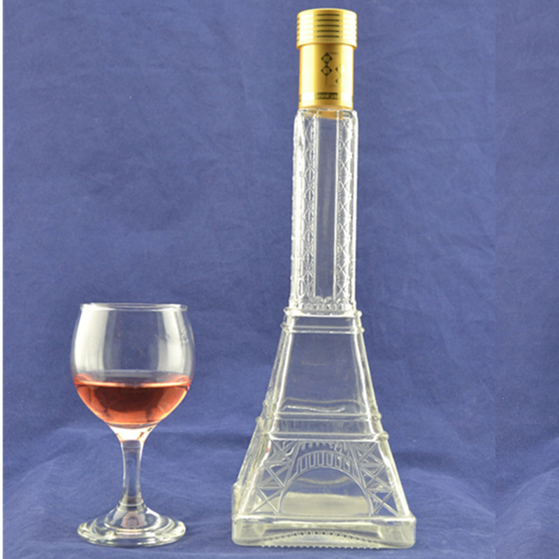 Matériau de verre en flint en relief haute Tour Eiffel Bouteille en verre en forme de liqueur avec liège